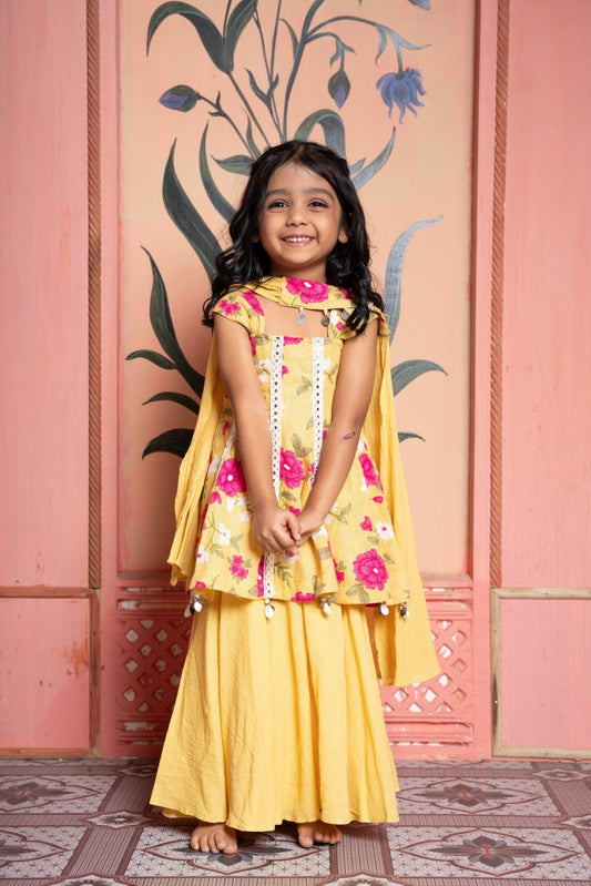 Sunny yellow floral peplum set with flared skirt and tassel dupatta—made for festive joy! - Kirti Agarwal