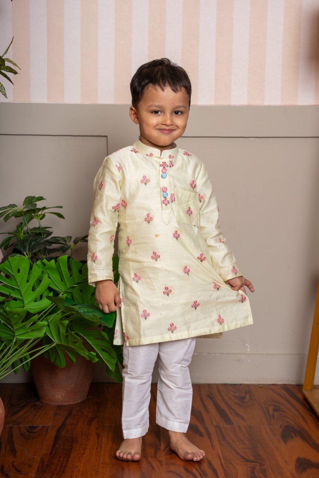 Add a splash of sunshine to your little one’s ethnic wardrobe with this pastel yellow floral kurta set - Kirti Agarwal