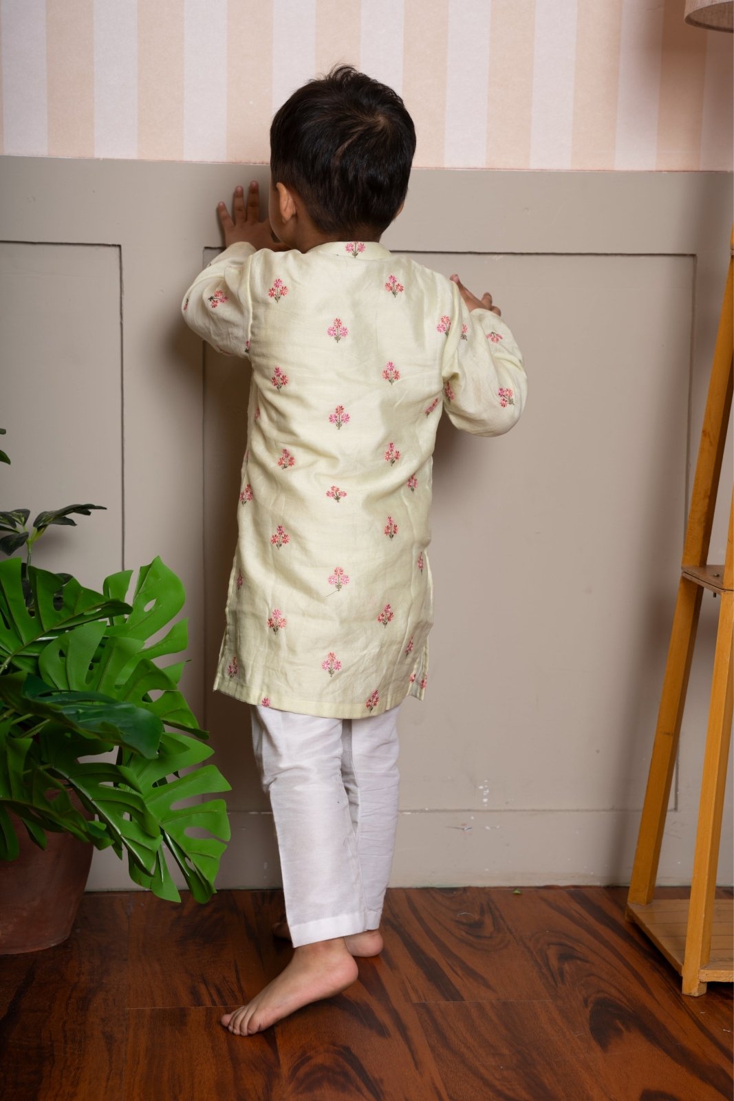 Add a splash of sunshine to your little one’s ethnic wardrobe with this pastel yellow floral kurta set - Kirti Agarwal