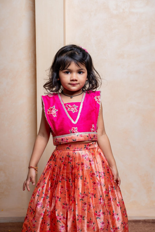 Add festive charm with this vibrant pink blouse and floral peach lehenga set for girls - Kirti Agarwal