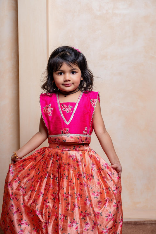 Add festive charm with this vibrant pink blouse and floral peach lehenga set for girls - Kirti Agarwal