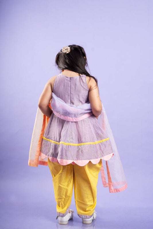 Adorable Lavender top with golden yellow dhoti pants and matching dupatta, perfect for festive celebrations - Kirti Agarwal
