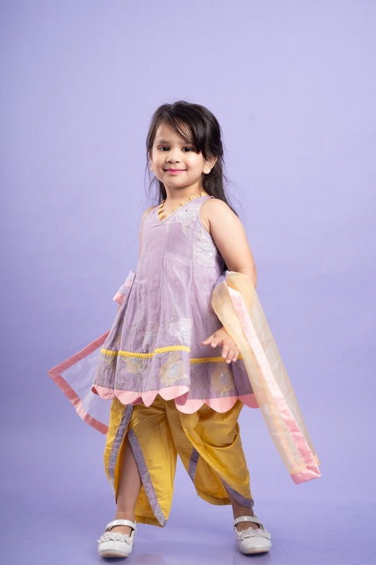Adorable Lavender top with golden yellow dhoti pants and matching dupatta, perfect for festive celebrations - Kirti Agarwal