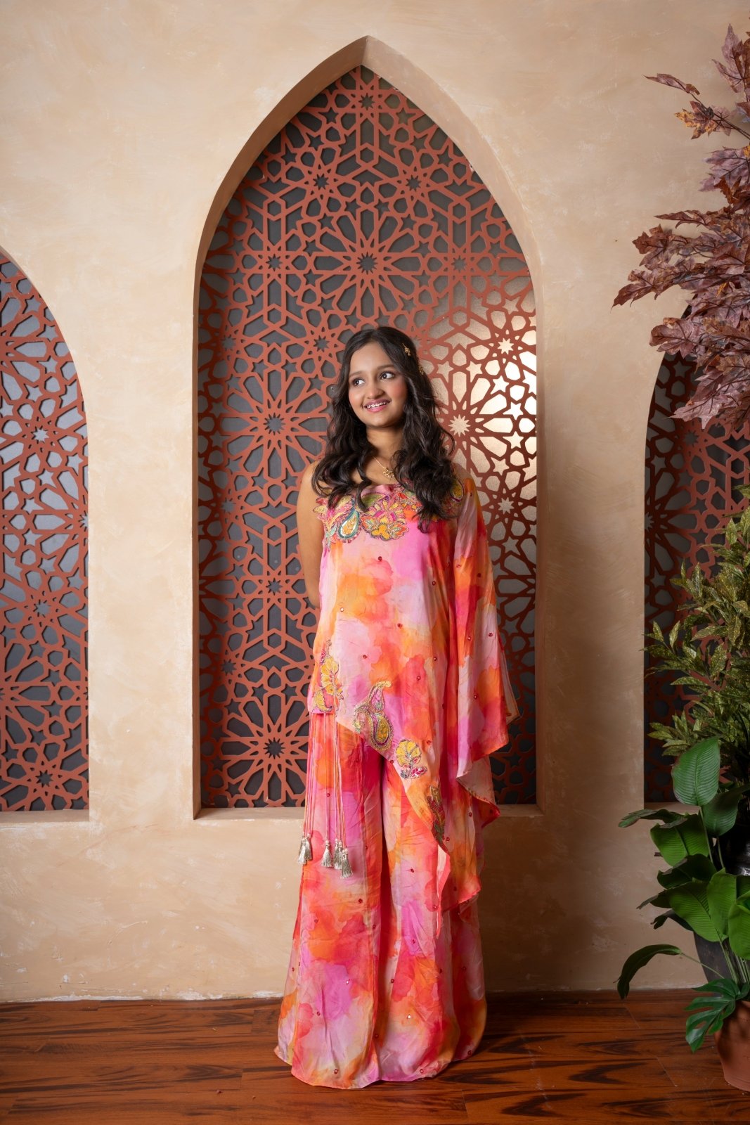 Brighten up festivities with this vibrant sibling twinning set in cheerful watercolor tones and playful embroidery. - Kirti Agarwal