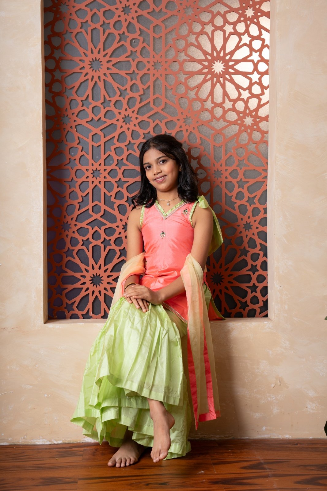 Charming orange and green sharara set with delicate embroidery and contrast dupatta — a joyful festive outfit for your little one. - Kirti Agarwal