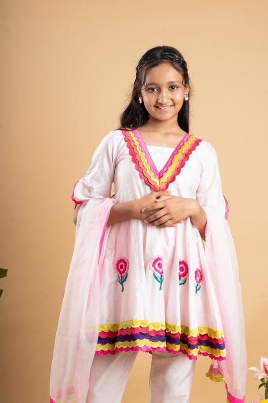Charming white kurta set with colorful scalloped details and floral embroidery, perfect for festive occasions - Kirti Agarwal