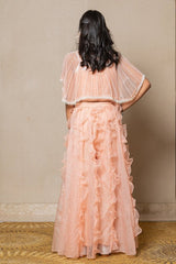 Chic Peach ensemble with beaded cape and ruffled palazzo pants, perfect for a stylish and elegant look at any occasion. - Kirti Agarwal