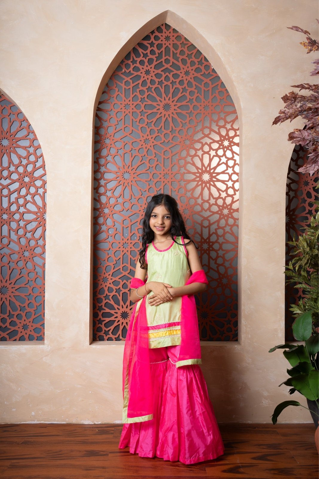 Chic pink and green sharara set with embroidered kurti and contrast dupatta — a perfect festive pick for young girls. - Kirti Agarwal