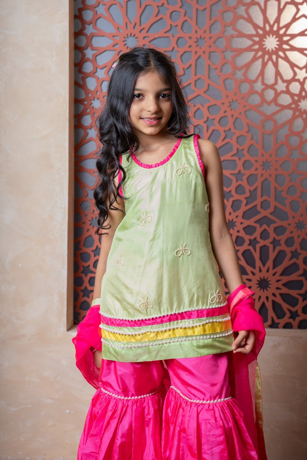 Chic pink and green sharara set with embroidered kurti and contrast dupatta — a perfect festive pick for young girls. - Kirti Agarwal
