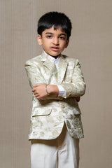 Elegant cream blazer with intricate green floral embroidery, paired with matching trousers and a crisp white shirt for a refined formal look - Kirti Agarwal