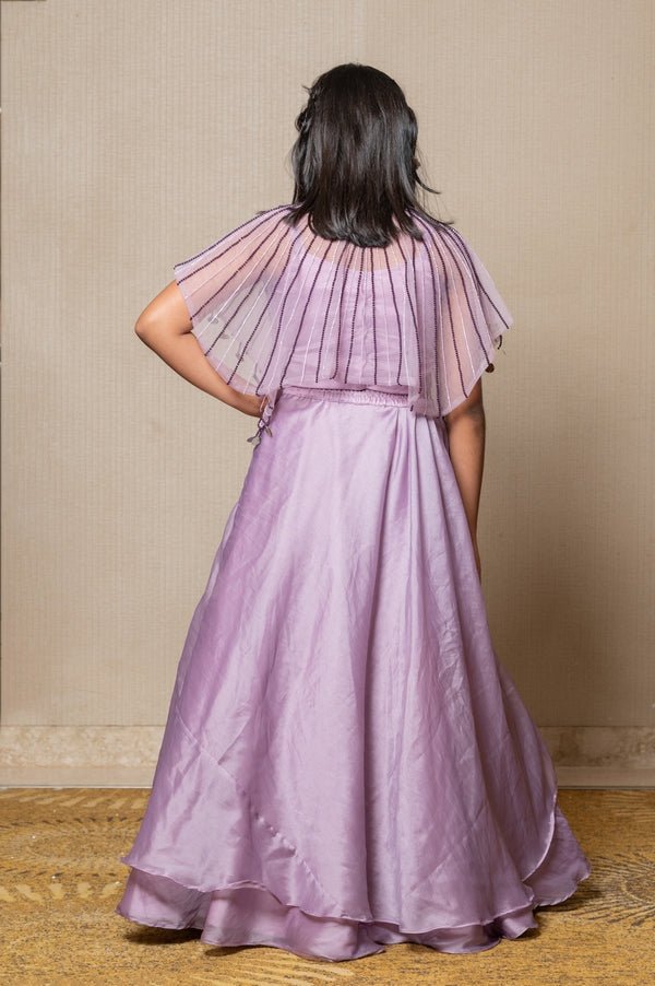 Elegant Lavender ensemble with a beaded cape and layered skirt, perfect for a graceful and sophisticated look at any special occasion. - Kirti Agarwal