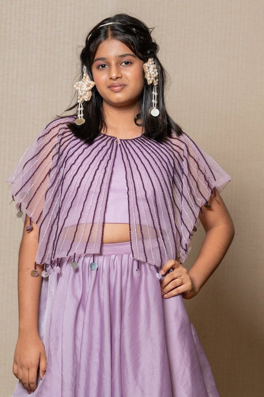 Elegant Lavender ensemble with a beaded cape and layered skirt, perfect for a graceful and sophisticated look at any special occasion. - Kirti Agarwal
