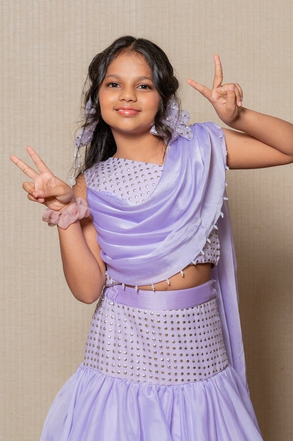 Elegant Lavender mermaid gown with sparkling embellishments and a draped neckline, perfect for a sophisticated look at any special event. - Kirti Agarwal