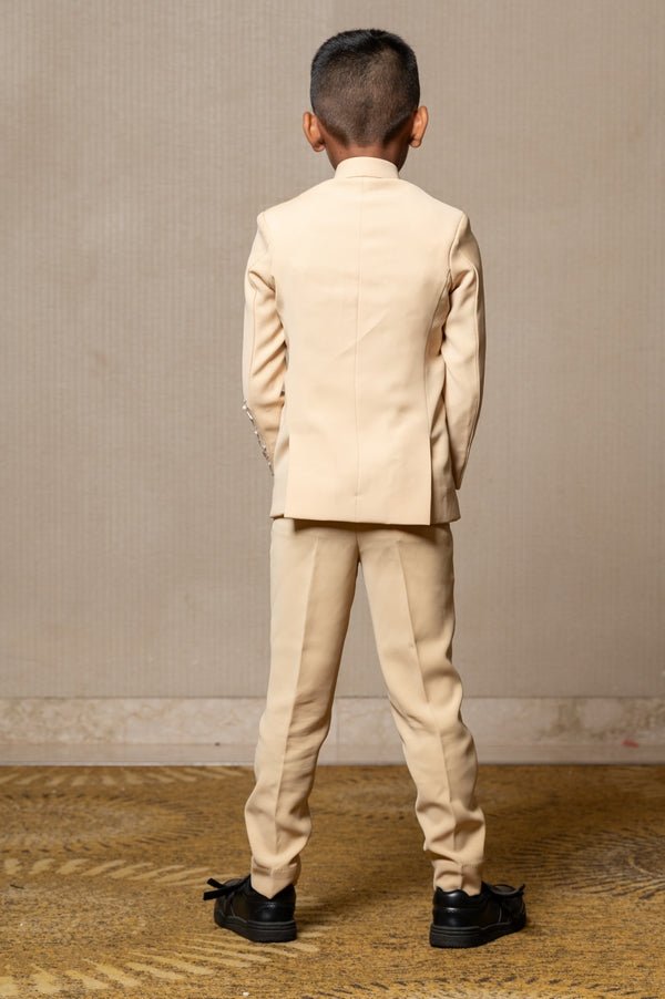 Elegant light beige bandhgala suit with delicate floral embroidery, paired with matching slim - fit trousers for a refined and sophisticated look - Kirti Agarwal