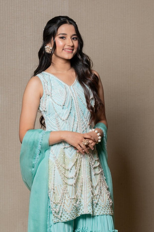 Elegant mint Green ensemble with intricate beadwork and layered pants, perfect for a stylish and graceful look at any special occasion. - Kirti Agarwal