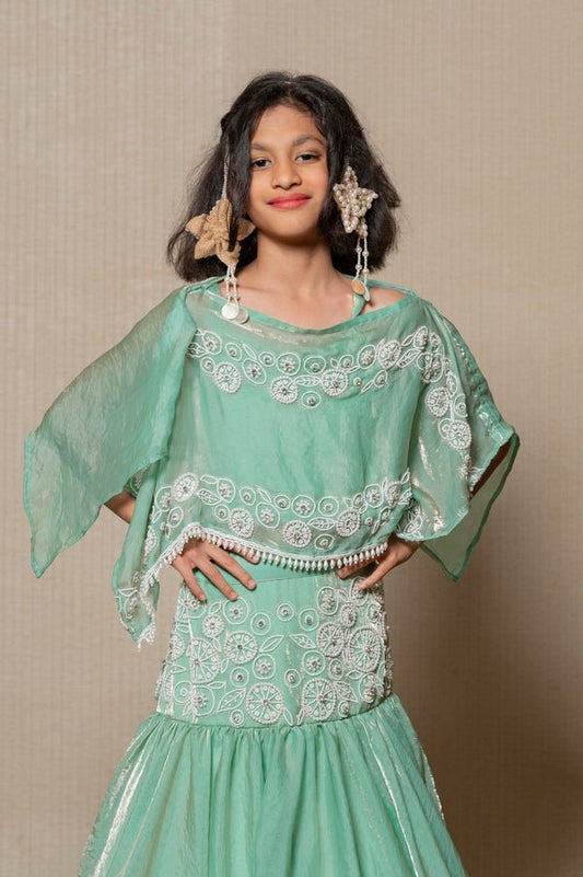 Elegant mint Green top and Lahenga with intricate white embroidery and a flowing silhouette, perfect for making a stylish statement at any festive occasion. - Kirti Agarwal