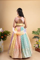 Elegant multicolored brocade lehenga set with intricate gold motifs and a matching pastel dupatta - Kirti Agarwal