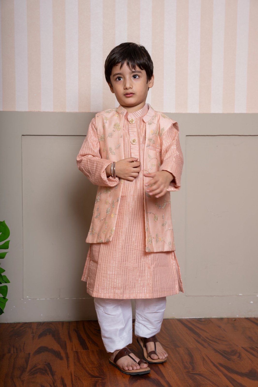Elegant peach kurta set with embroidered Nehru jacket—perfect for festive flair and timeless charm. - Kirti Agarwal