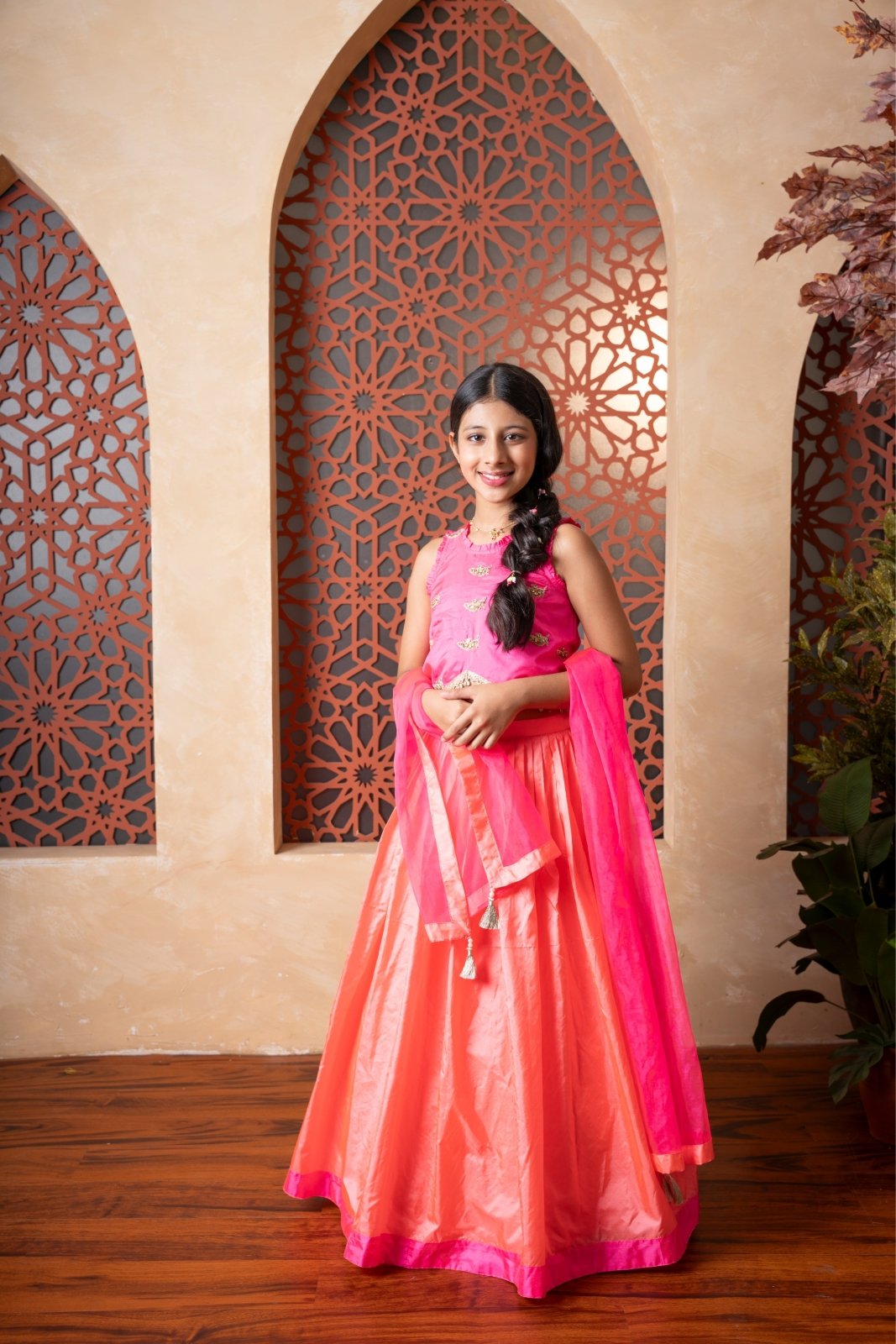 Elegant pink and orange lehenga set with intricate hand embroidery and tassel - detailed dupatta — perfect for festive occasions. - Kirti Agarwal