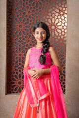 Elegant pink and orange lehenga set with intricate hand embroidery and tassel - detailed dupatta — perfect for festive occasions. - Kirti Agarwal