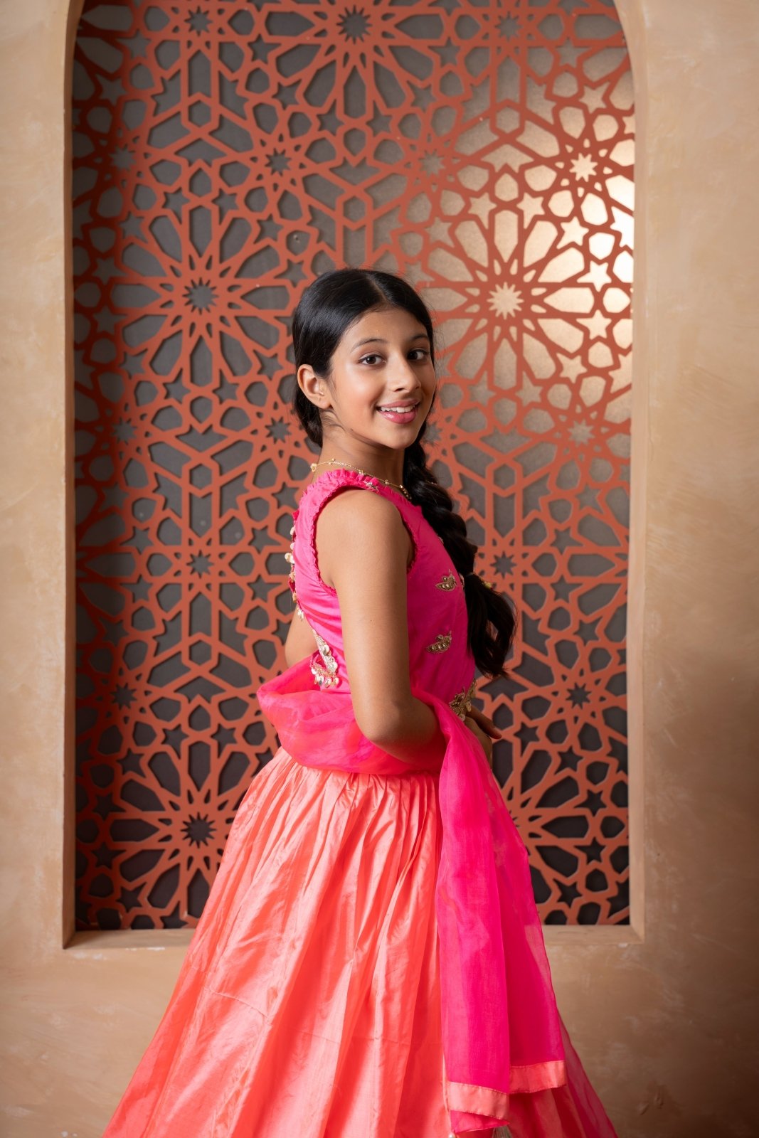 Elegant pink and orange lehenga set with intricate hand embroidery and tassel - detailed dupatta — perfect for festive occasions. - Kirti Agarwal