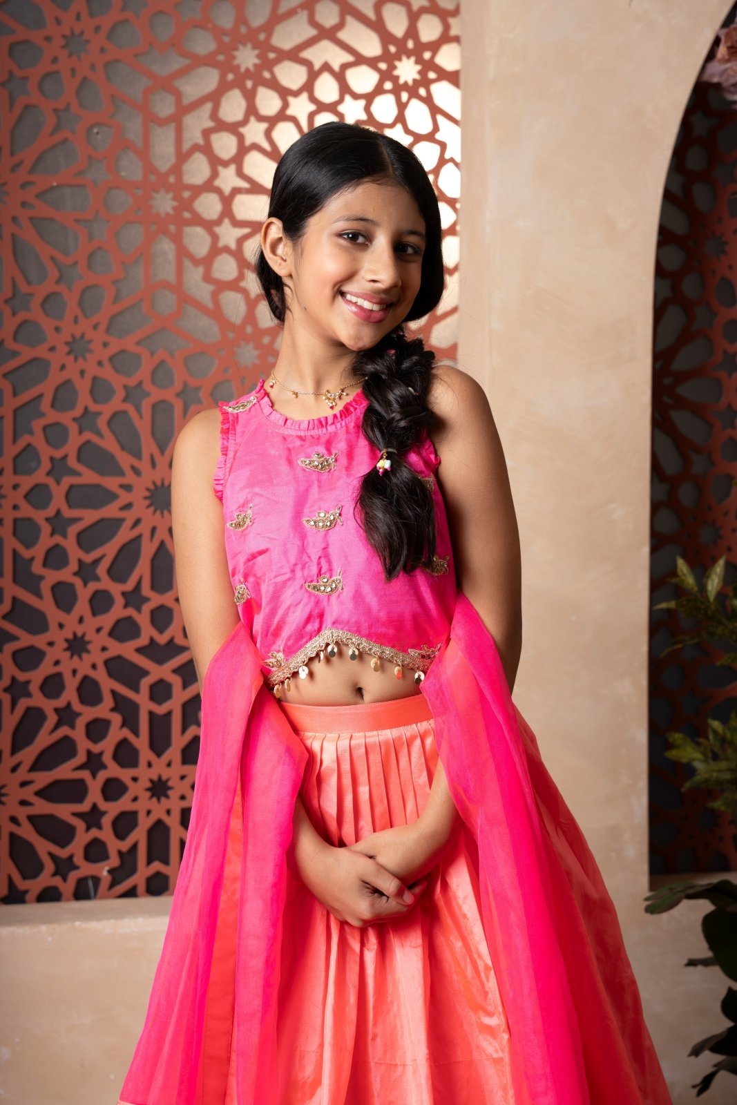 Elegant pink and orange lehenga set with intricate hand embroidery and tassel - detailed dupatta — perfect for festive occasions. - Kirti Agarwal