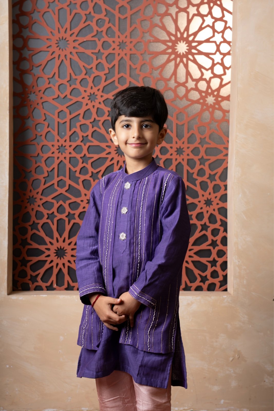 Elevate festive looks with this royal purple kurta and peach pant set for boys. - Kirti Agarwal