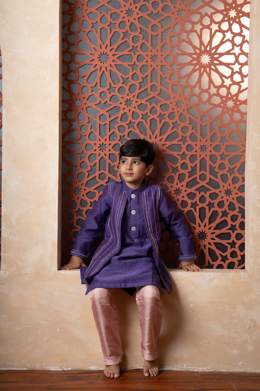 Elevate festive looks with this royal purple kurta and peach pant set for boys. - Kirti Agarwal