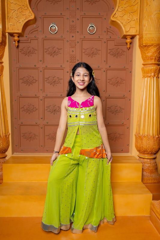 Girls festive sharara set in vibrant pink and lime green, crafted in soft Georgette with Brocade Silk accents, featuring mirror work, sequins, and elegant detailing – perfect ethnic wear for weddings, parties, and celebrations - Kirti Agarwal