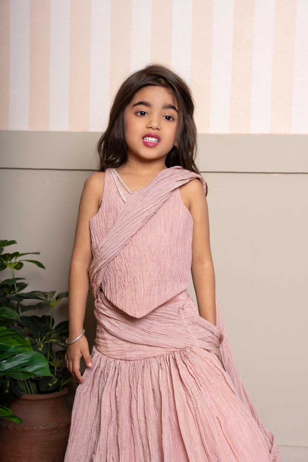 Graceful and breezy, this dusty pink crinkled lehenga set brings a fusion flair to festive style - Kirti Agarwal