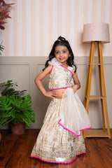 Graceful cream lehenga set with golden palace print and vibrant pink highlights for a festive royal charm. - Kirti Agarwal