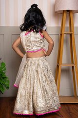 Graceful cream lehenga set with golden palace print and vibrant pink highlights for a festive royal charm. - Kirti Agarwal