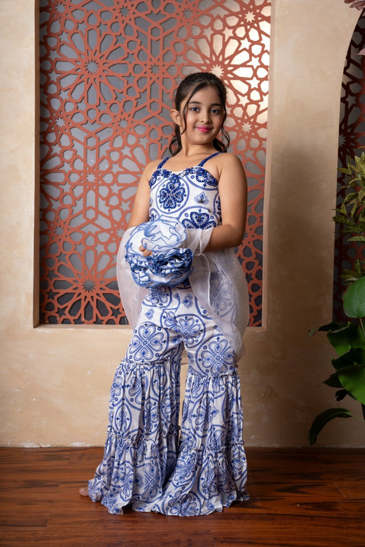 Graceful hand - embroidered sharara set with intricate prints and tiered ruffles — a charming festive pick for your little style icon. - Kirti Agarwal