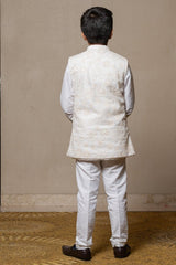 Ivory embroidered Nehru jacket paired with a classic white shirt and pants for an elegant traditional look. - Kirti Agarwal