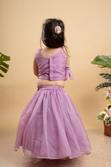 Lavender lehenga with an asymmetrical top, adorned with gold and pink embellishments