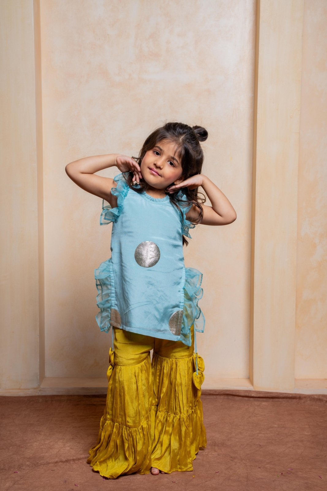 Let your little diva shine in this trendy crepe tunic and chiffon sharara set — a perfect pick for festive celebrations and special occasions - Kirti Agarwal