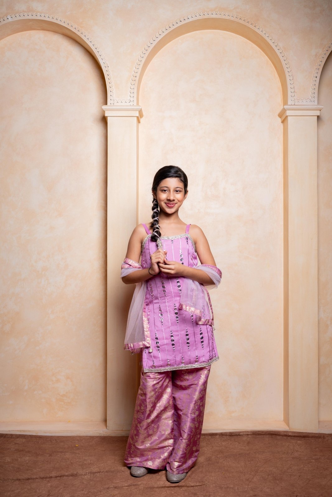 Make your princess shine in this embroidered Chinnon silk kurti, brocade sharara, and net dupatta set – perfect for festive celebrations - Kirti Agarwal