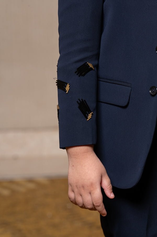 Navy blue blazer with elegant metallic embroidery, paired with matching trousers and a crisp white shirt for a refined formal look - Kirti Agarwal