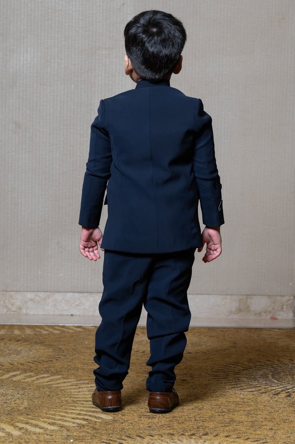 Navy blue blazer with elegant metallic embroidery, paired with matching trousers and a crisp white shirt for a refined formal look - Kirti Agarwal