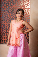 Orange embroidered kurti with flared pink palazzos — a vibrant and elegant ensemble for festive flair. - Kirti Agarwal