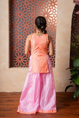 Orange embroidered kurti with flared pink palazzos — a vibrant and elegant ensemble for festive flair. - Kirti Agarwal
