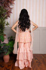 Peach peplum sharara set with dupatta and shimmer - layered ruffles for a festive - ready look. - Kirti Agarwal