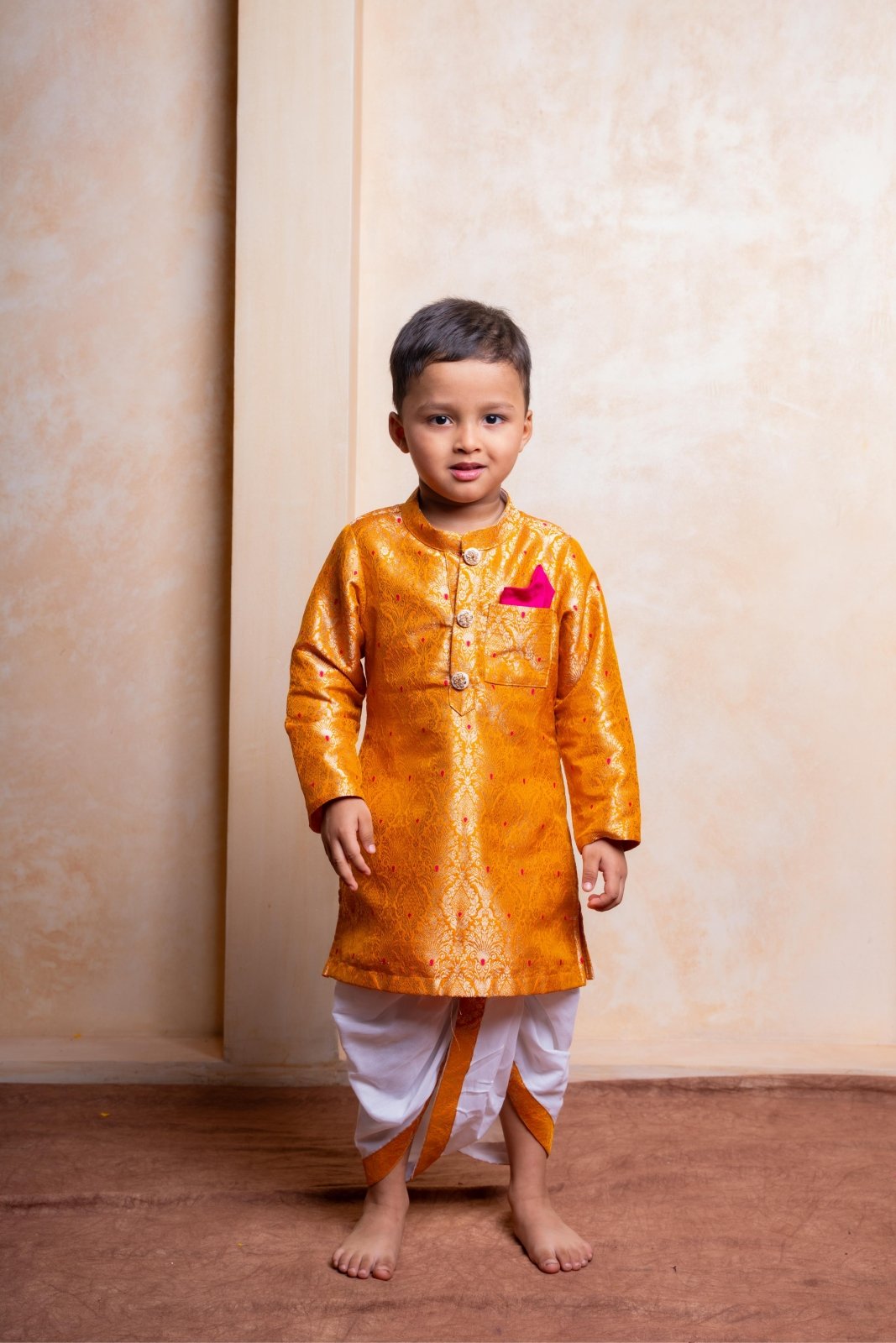 Royal golden silk kurta with traditional dhoti – a perfect festive outfit for boys to shine at weddings and celebrations - Kirti Agarwal