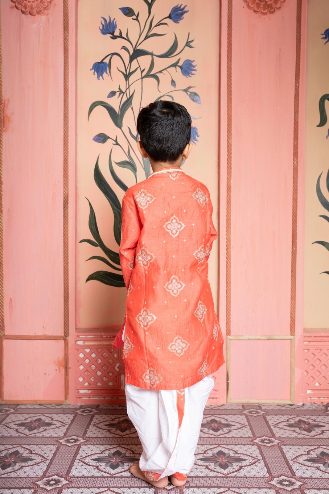 Rust - orange embroidered kurta paired with contrast white dhoti for a timeless festive statement. - Kirti Agarwal