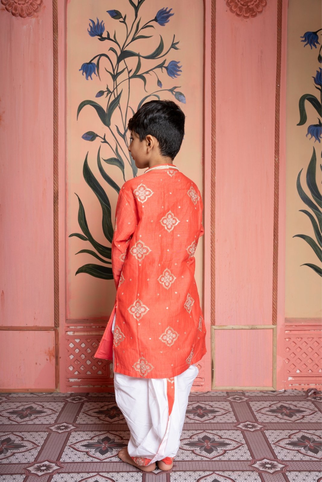 Rust - orange embroidered kurta paired with contrast white dhoti for a timeless festive statement. - Kirti Agarwal