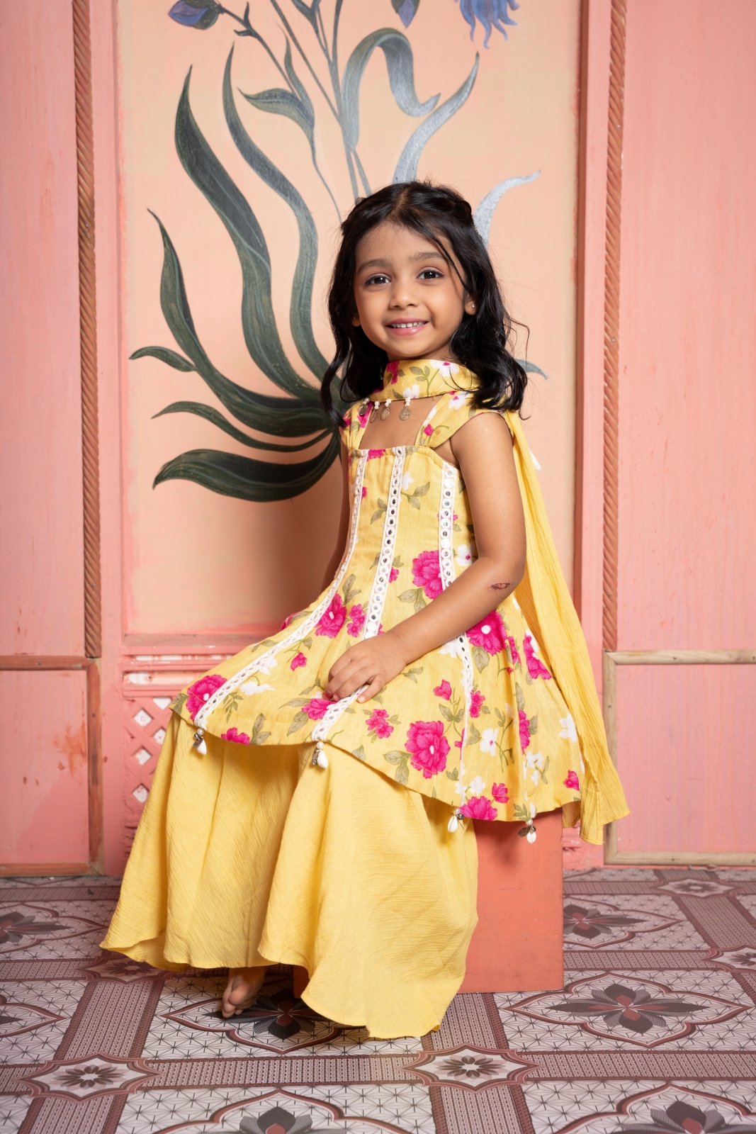 Sunny yellow floral peplum set with flared skirt and tassel dupatta—made for festive joy! - Kirti Agarwal