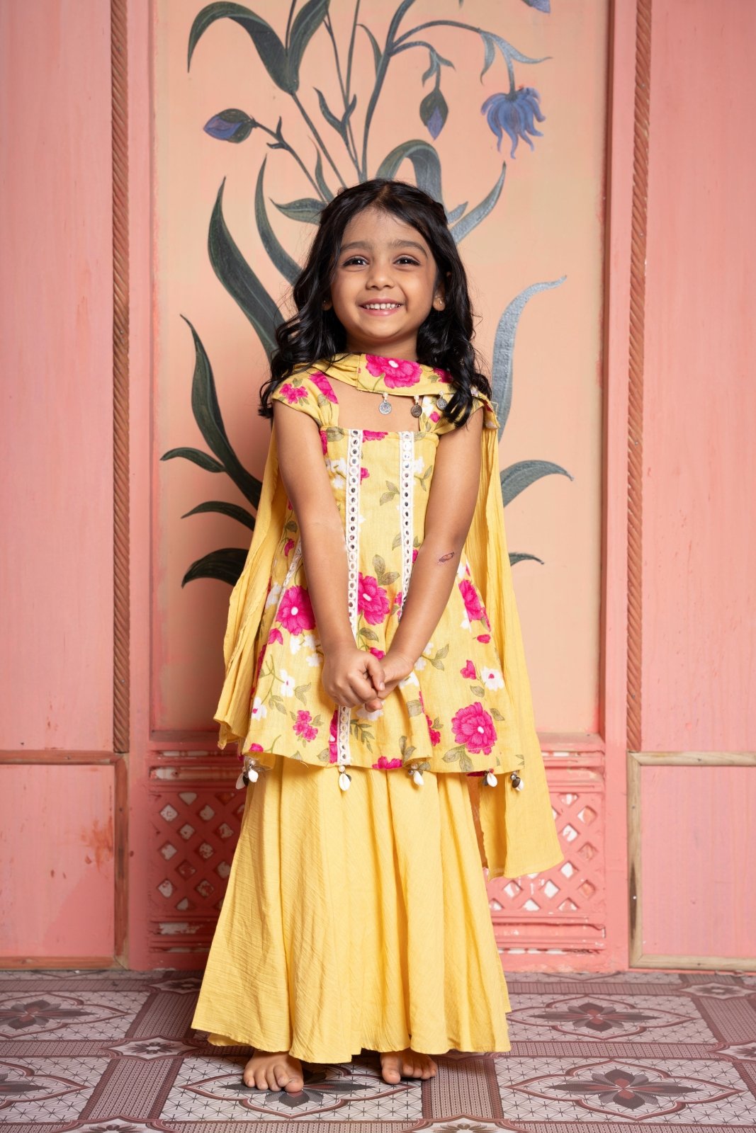 Sunny yellow floral peplum set with flared skirt and tassel dupatta—made for festive joy! - Kirti Agarwal