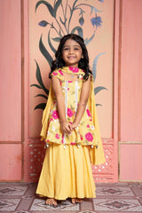Sunny yellow floral peplum set with flared skirt and tassel dupatta—made for festive joy! - Kirti Agarwal