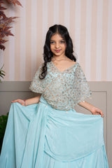 Twirl into elegance with this dreamy sea green cape top and lehenga set, perfect for festive flair. - Kirti Agarwal