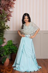 Twirl into elegance with this dreamy sea green cape top and lehenga set, perfect for festive flair. - Kirti Agarwal